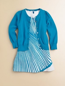A classic long-sleeved cardigan is rendered in a soft knit and adorned with clear buttons and Pointelle trim for a timeless look.CrewneckLong sleevesButton frontPointelle detail at collar, buttons, cuffs and hem70% viscose/30% polyesterDry cleanImported Please note: Number of buttons may vary depending on size ordered. A classic long-sleeved cardigan is rendered in a soft knit and adorned with clear buttons and Pointelle trim for a timeless look.CrewneckLong sleevesButton frontPointelle detail at collar, buttons, cuffs and hem70% viscose/30% polyesterDry cleanImported Please note: Number of buttons may vary depending on size ordered.