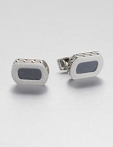 From the Batu Bedeg Collection. In a curved rectangular shape, this stunning design combines panels of sleek hematine with a carved setting of sterling silver.HematineSterling silverSwivel backMade in Bali From the Batu Bedeg Collection. In a curved rectangular shape, this stunning design combines panels of sleek hematine with a carved setting of sterling silver.HematineSterling silverSwivel backMade in Bali