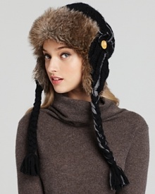 Soft faux fur lines Nobis' warm, wooly cap, trimmed with braids, buttons and tassels. Soft faux fur lines Nobis' warm, wooly cap, trimmed with braids, buttons and tassels.