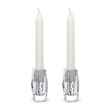 Inspired by a celebrated design of George Chevalier in the 1930s, Thomas Bastide's diamond-cut candlesticks feature interior ruffle cuts to maximize light dispersion.