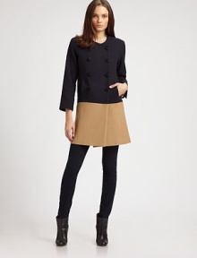 This chic, structural wool design has a decidedly retro sensibility.Jewel necklineDouble-breasted button frontSide slash pocketsThree-quarter sleeves with vented cuffsFully linedAbout 33 from shoulder to hemWoolDry cleanMade in USAModel shown is 5'10 (177cm) wearing US size Small. 