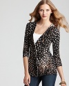 Cozy up for fall in this formfitting Trina Turk sweater, touting an exotic animal print.