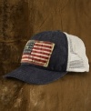 A classic baseball cap gets a downtown overhaul in weathered denim with an old-school American flag patch for a timeless, vintage feel.