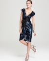 A contemporary take on 70s-inspired glam is perfected in this molten creation: BCBGMAXAZRIA's sequin dress.