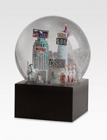 EXCLUSIVELY OURS. The Las Vegas musical snowglobe features city scenes and landmarks, including: Hoover DamStratosphereElvis impersonatorShowgirlsCasinoStatue of LibertyCasino-style Sphinx and PyramidPlays Luck Be A LadyImported