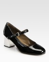 Patent leather Mary Jane pump lifted by a sartorially significant heel. Silvertone heel, 2¼ (60mm)Patent leather upperAdjustable ankle strapLeather lining and solePadded insoleMade in Italy