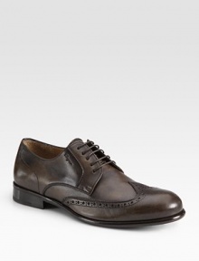 Oxford perforations define this classic style crafted in smooth Italian calfskin leather.Leather upperLeather liningPadded insoleLeather soleMade in Italy Oxford perforations define this classic style crafted in smooth Italian calfskin leather.Leather upperLeather liningPadded insoleLeather soleMade in Italy
