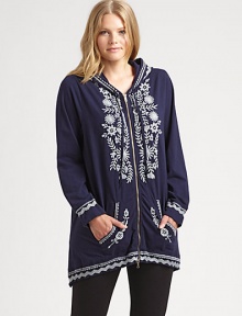 Exquisite embroidery completes this stretch-cotton look creating a flawless go-to piece. Pair this hooded tunic with simple pants.Attached hoodLong sleevesZipper frontFront pocketsAbout 30 from shoulder to hem95% cotton/5% spandexMachine washImported