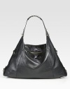 A slouchy style in supple leather accented with edgy studs.Top handle, 8 dropTop zip closureOne inside zip pocketTwo inside open pocketsFully lined18W X 11½H X 6½DMade in Italy
