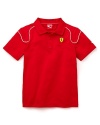A bold shade of red and the classic Ferrari logo takes a PUMA polo to the next level of cool.