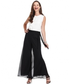 These evening pants from Onyx are effortlessly elegant with a wide, flare-leg silhouette and sheer chiffon overlay. These evening pants from Onyx are effortlessly elegant with a wide, flare-leg silhouette and sheer chiffon overlay.