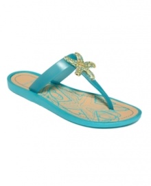 You're only steps away from the ocean with the beach-inspired Nancita sandals by Nine West. A bejeweled starfish tops off the straps. You're only steps away from the ocean with the beach-inspired Nancita sandals by Nine West. A bejeweled starfish tops off the straps.