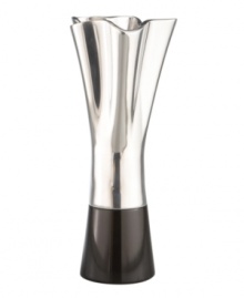 Designer Neil Cohen combines sleek black granite and fluted Nambe metal in the Rocks vase for bold, Southwestern style. Designer Neil Cohen combines sleek black granite and fluted Nambe metal in the Rocks vase for bold, Southwestern style.