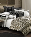 An embroidered swirl motif in a dramatic black and white palette embellishes this decorative pillow from N Natori, the perfect complement to the Silk Road comforter sets.