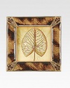 The distinctive colorations of tortoise shell have been cleverly expressed in this frame's striking enamel work, with sparkling Swarovski crystals in complementary hues at each corner.Enamel and crystal18k matte gold finishHandmade, hand-enameled and hand-set2.75 square; holds a 2 square photoImported