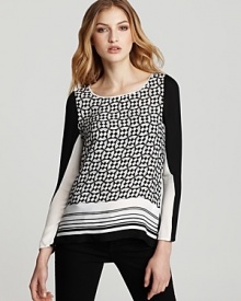 Clever color-blocking and a monochrome print lend statement style to this Rebecca Minkoff silk top.