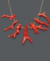 Make your style sizzle with this red-hot sensation! Necklace features bright coral branches suspended from a delicate 14k gold chain. Approximate length: 18 inches. Approximate drop: 1 inch.