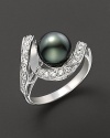 Black Tahitian pearl ring with channel-set diamonds.