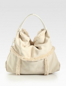 Luxurious dyed shearling in a soft and slouchy design.Double top handles, 6 dropMagnetic top closureOne inside zip pocketTwo inside open pocketsFully lined16W X 13H X 9DImported Luxurious dyed shearling in a soft and slouchy design.Double top handles, 6 dropMagnetic top closureOne inside zip pocketTwo inside open pocketsFully lined16W X 13H X 9DImported