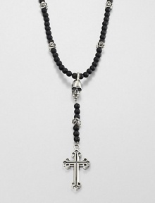 A traditional cross pendant is suspended from an impeccable strand of black onyx beads with sculpted skull detail for an edgy, modern update.Sterling silverBlack onyxLength about 26Toggle claspMade in USA A traditional cross pendant is suspended from an impeccable strand of black onyx beads with sculpted skull detail for an edgy, modern update.Sterling silverBlack onyxLength about 26Toggle claspMade in USA