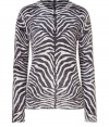 Luxe pullover in pure, black and white cashmere - Extremely soft, super-fine material feels great and looks just as good - Eye-catching, on-trend graphic zebra print - Slim cut tapers at waist, hits just below hips - Classic crew neck, piping detail at collar and shoulder seams - Dress up with a leather pencil skirt of wide-leg trousers - Go for a more casual look with skinny jeans and ballet flats