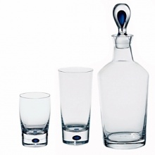The Intermezzo Blue barware features a dramatic teardrop of blue in the base. Designed by Erika Lagerbielke . Shown from left to right - double old fashion, tumbler, decanter. Also available but not shown: wine carafe. The Intermezzo Blue barware features a dramatic teardrop of blue in the base. Designed by Erika Lagerbielke . Shown from left to right - double old fashion, tumbler, decanter. Also available but not shown: wine carafe.
