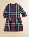 Familiar checks in unexpected colors on crisp cotton with pretty ruffled trim.Ruffled V necklineThree-quarter sleeves with ruffled cuffsButton placketSlightly dropped waist, softly gatheredTiny pleats at back necklineCottonMachine washImported Please note: Number of buttons may vary depending on size ordered. 