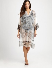 A design with all the makings for the perfect coverup: lightweight, printed and feminine.V-neckDolman sleevesPull-on styleSilkDry cleanMade in Italy A design with all the makings for the perfect coverup: lightweight, printed and feminine.V-neckDolman sleevesPull-on styleSilkDry cleanMade in Italy