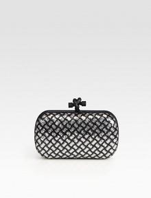 Glittering sequin allover leather, this petite design with a diamond-shape pattern and an unique knot detailed closure will definitely stand out in a crowd.Top clasp closureSuede lining7¼W X 4¼H X ¾DMade in Italy Glittering sequin allover leather, this petite design with a diamond-shape pattern and an unique knot detailed closure will definitely stand out in a crowd.Top clasp closureSuede lining7¼W X 4¼H X ¾DMade in Italy