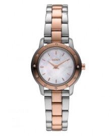 Mix it up with the contrasting metals of this mini. Watch by DKNY crafted of stainless steel bracelet with rose-gold tone center links and round case. Rose-gold tone bezel embellished with crystal accents. White mother-of-pearl dial features rose-gold tone stick indices, two hands and logo. Quartz movement. Water resistant to 30 meters. Two-year limited warranty. Mix it up with the contrasting metals of this mini. Watch by DKNY crafted of stainless steel bracelet with rose-gold tone center links and round case. Rose-gold tone bezel embellished with crystal accents. White mother-of-pearl dial features rose-gold tone stick indices, two hands and logo. Quartz movement. Water resistant to 30 meters. Two-year limited warranty.