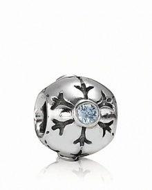 A delicately etched snowflake with a sparkling aqua zirconia center adorns this sterling silver charm by PANDORA. A delicately etched snowflake with a sparkling aqua zirconia center adorns this sterling silver charm by PANDORA.
