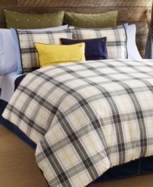 Tommy Hilfiger's Lake George duvet cover set features a classic plaid design in olive, blue and ivory tones accented with pops of yellow. Finished with blue tape binding for a clean look. Reverses to solid.