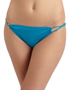 THE LOOKBraided side straps with silvery bead and disc accentsElastic waist and leg openingsTHE MATERIAL85% Meryl nylon/15% spandexFully linedCARE & ORIGINHand washImportedPlease note: Bikini top sold separately. THE LOOKBraided side straps with silvery bead and disc accentsElastic waist and leg openingsTHE MATERIAL85% Meryl nylon/15% spandexFully linedCARE & ORIGINHand washImportedPlease note: Bikini top sold separately.