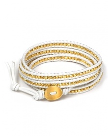 Add a touch of boho glamour to your look with this gold-embellished leather wrap bracelet from Chan Luu.