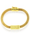 Mesh together the perfect outfit. Anne Klein's flex bracelet features a mesh pattern punctuated with a solid, shiny accent. Crafted in gold tone mixed metal. Approximate diameter: 8 inches.