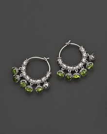 Inspired by Zen philosophy, these hoop earrings from Paul Morelli feature intricately detailed sterling silver meditation bells, set with peridot cabochons. Inspired by Zen philosophy, these hoop earrings from Paul Morelli feature intricately detailed sterling silver meditation bells, set with peridot cabochons.