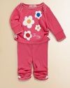 Adorned with fun and funky flowers, this sweet and girlie set will make her smile.Envelope necklineLong sleevesPullover styleElastic waistband with button detailScalloped trim on neck, cuffs and anklesSide-ruched anklesCottonMachine washImportedAdditional InformationKid's Apparel Size Guide 