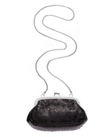 Simple yet stunning, this sequin bag by Calvin Klein is ideal for a chic night out on the town. Silver-tone accents and a concealable shoulder strap add versatility to this glamorous design. Simple yet stunning, this sequin bag by Calvin Klein is ideal for a chic night out on the town. Silver-tone accents and a concealable shoulder strap add versatility to this glamorous design.