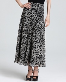 Lend elegant movement to your daily look with this tribal-print DKNYC maxi skirt. Play up the global sentiment with layered necklaces and stacked bangles. Lend elegant movement to your daily look with this tribal-print DKNYC maxi skirt. Play up the global sentiment with layered necklaces and stacked bangles.
