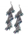 Get swept up in this tornado-inspired style. Bar III's swirling drop earrings gracefully dust the shoulders and feature a little shimmer with the addition of blue resin beads. Crafted in hematite-plated mixed metal. Approximate drop: 3 inches.