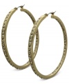 Fashion that covers all bases. These golden hoop earrings from GUESS sparkle both inside and out with glass accents. Crafted in gold tone mixed metal. Approximate drop: 2 inches.