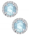 A mesmerizing accent piece, from CRISLU. These stud earrings feature a dome-cut center stone aquamarine (1-1/5 ct. t.w.) surrounded by micro-pave cubic zirconia accents. Earrings set in platinum over sterling silver. Approximate diameter: 1/3 inch.