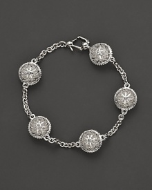 Inspired by Zen philosophy, this intricately detailed sterling silver bracelet from Paul Morelli softly jingles with meditation bells. Inspired by Zen philosophy, this intricately detailed sterling silver bracelet from Paul Morelli softly jingles with meditation bells.