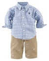 A timeless, preppy set pairs a classic plaid button-down shirt with an embroidered chino pant for a heritage look.