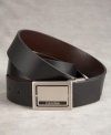 Reversible from brown to black, this smooth leather belt is a true multi-tasker. The silver plaque buckle gives it a distinctly modern edge, and flips to offer a whole different look.