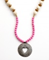 Open your heart. Strung with wooden beads and a hand-cut and hammered pendant, this Heart of Haiti necklace is crafted by a co-op that supports women's employment in local communities.