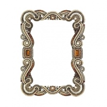 Cast pewter in an antique brass finish with dozens of hand-set Swarovski® crystals, tiger's eye, faux pearls, and a scroll pattern decorative back frame your favorite photos in sparkling style. Cast pewter in an antique brass finish with dozens of hand-set Swarovski® crystals, tiger's eye, faux pearls, and a scroll pattern decorative back frame your favorite photos in sparkling style.
