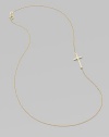 A wispy chain of 14k yellow gold features a cross pendant set askew for a modern edge.14k yellow gold Length, about 16 Pendant length, about ¾ Spring ring clasp Made in USA