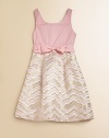 A full skirt with wavy metallic detail and a cinched, bow and sash waistline define this elegant frock.ScoopneckSleevelessBack zipperWaistband sash with bowFlat front pocketsFull skirtCottonMachine washImported