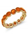 Slip on sunburst tones this season. This Charter Club bracelet features orange-colored plastic beads on a 14k gold-plated mixed metal setting. Bracelet stretches to fit wrist. Approximate diameter: 2-1/4 inches.